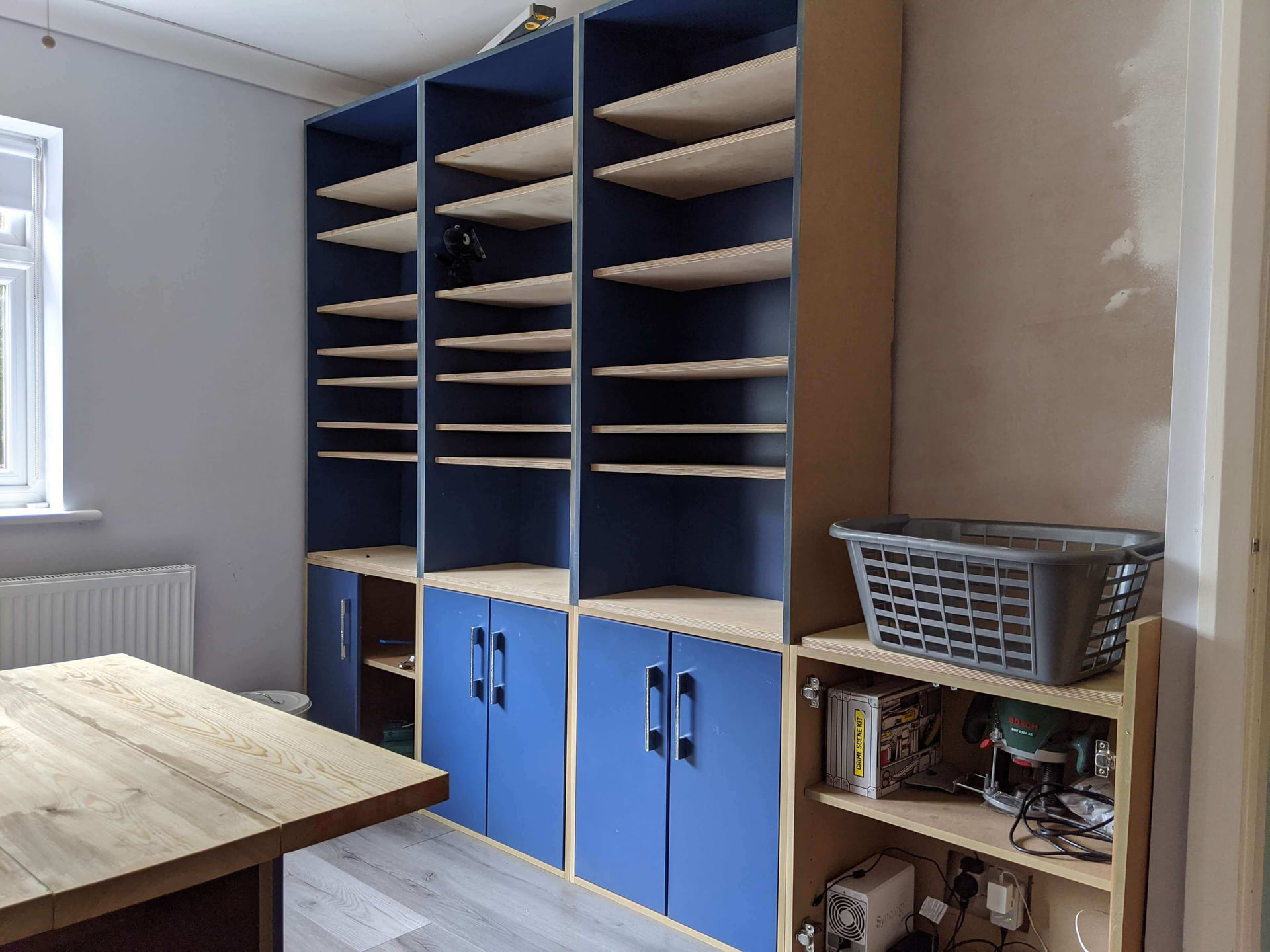 Painted fitted storage with integrated shelving for a period home
