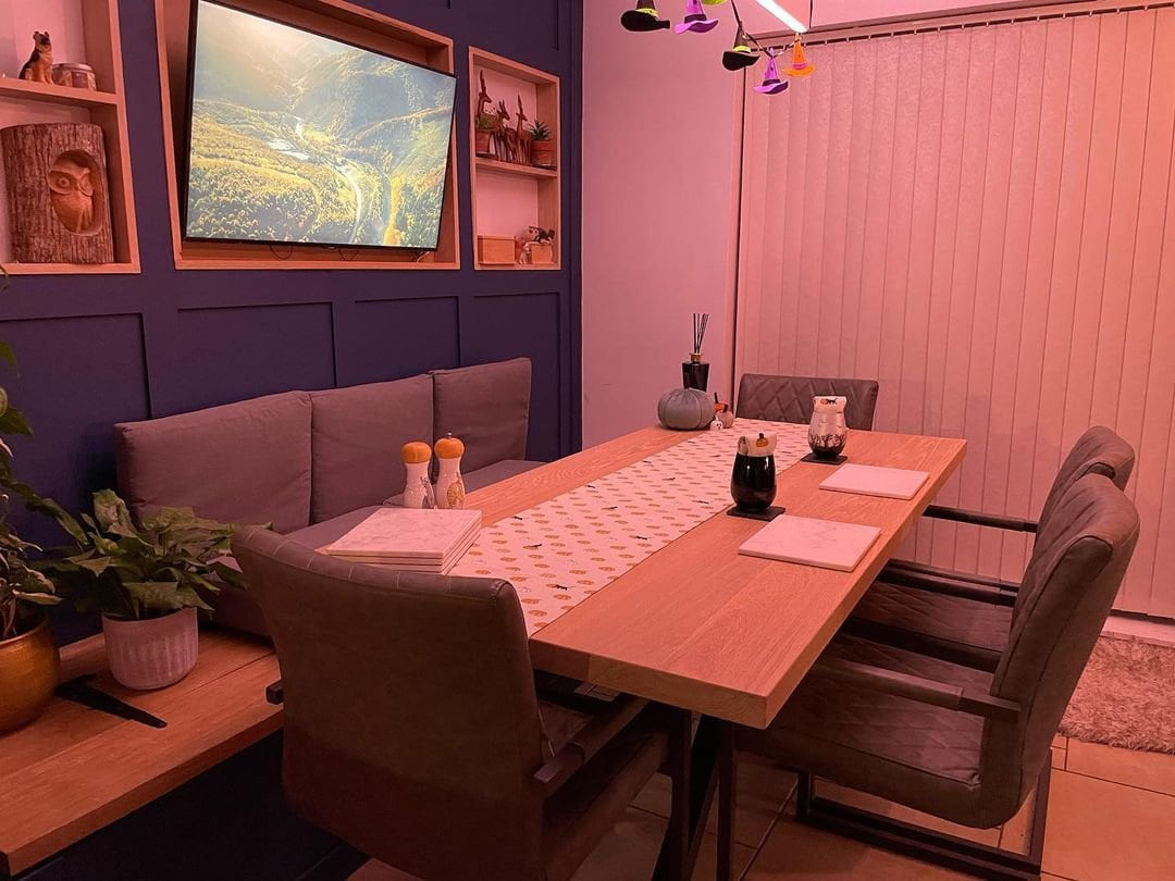 Solid white oak dining table with steel legs, handmade in Staffordshire